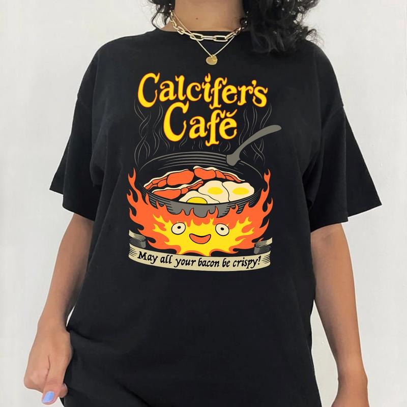 Calcifer's Cafe May All Your Bacon & Eggs Be Crispy Cooking T-Shirt Hoodie, Sweatshirt | UrbanDripWear.com