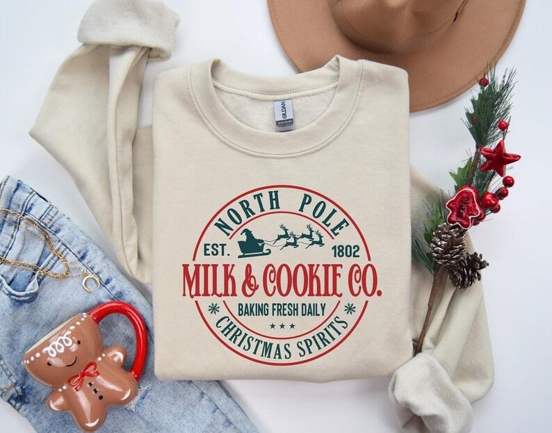 Christmas Sweatshirt, North Pole Milk and Cookie Co, Cozy Holiday Tee Hoodie | UrbanDripWear.com