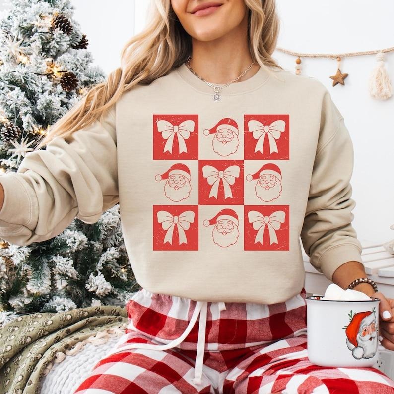 Coquette Bow Santa Claus Christmas Sweatshirt, Checkered Santa Xmas T-shirt, Vintage Christmas Shirt, Christmas Vibes...