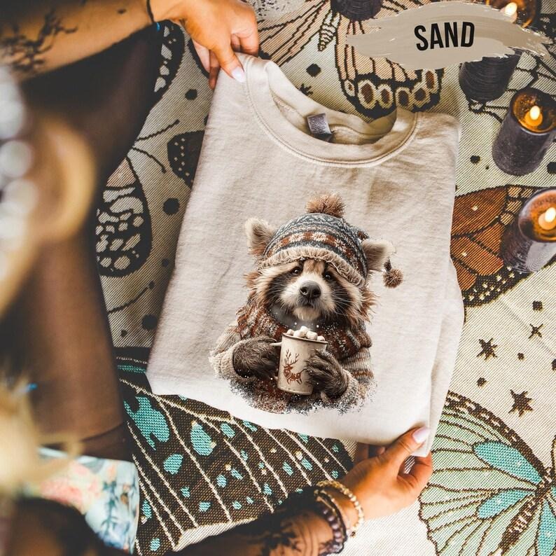 Cozy Winter Raccoon Sweatshirt, Cute Animal Hot Cocoa Sweater, Christmas Pullover T-Shirts, Hoodie | UrbanDripWear.com
