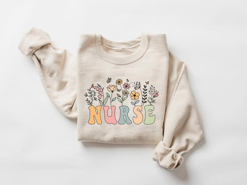 Floral Nurse Sweatshirt, Wildflower Nurse Shirt, Nursing Tee, Nurse Graduation Gift, ER RN Gift For Nurse Week Shirt,...