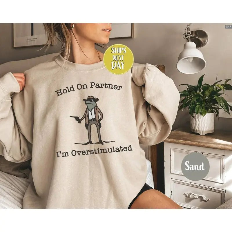 Hold On Partner I'm Overstimulated Cowboy Frog Funny Meme Sweatshirt, Retro Crewneck, Gift For Lovers, Cotton, Trendy...