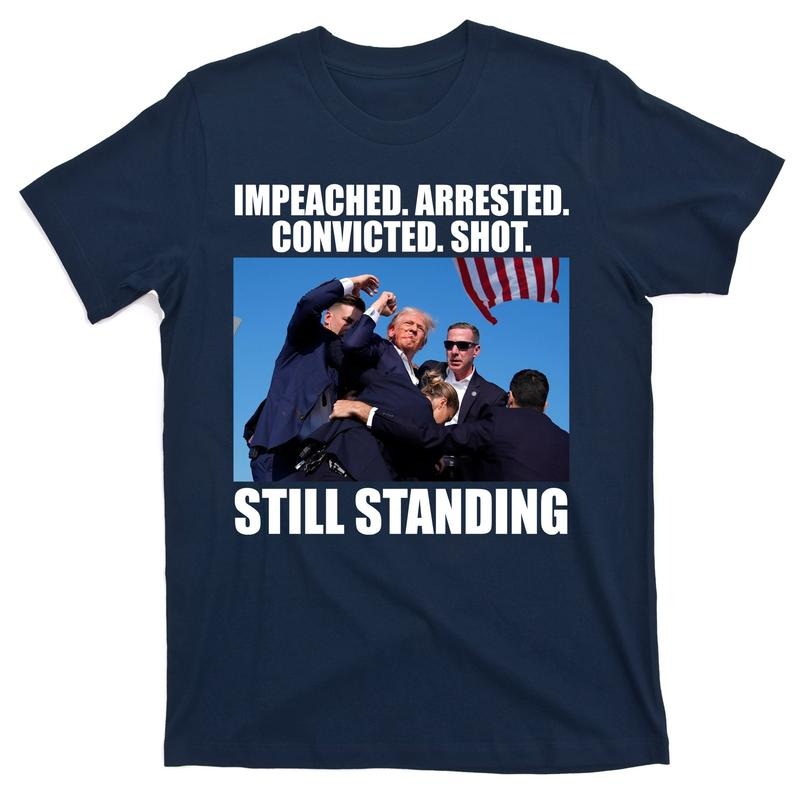 Impeached Arrested Convicted Shot Still Standing Donald Trump T-Shirt Hoodie, Sweatshirt | UrbanDripWear.com