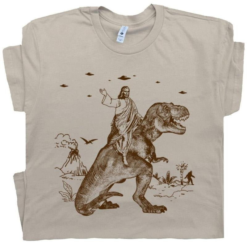 Jesus Riding Dinosaur T Shirt UFO T Shirt Funny T Shirts Cotton Menswear Top Polyester Hoodie, Sweatshirt | UrbanDripWear.com
