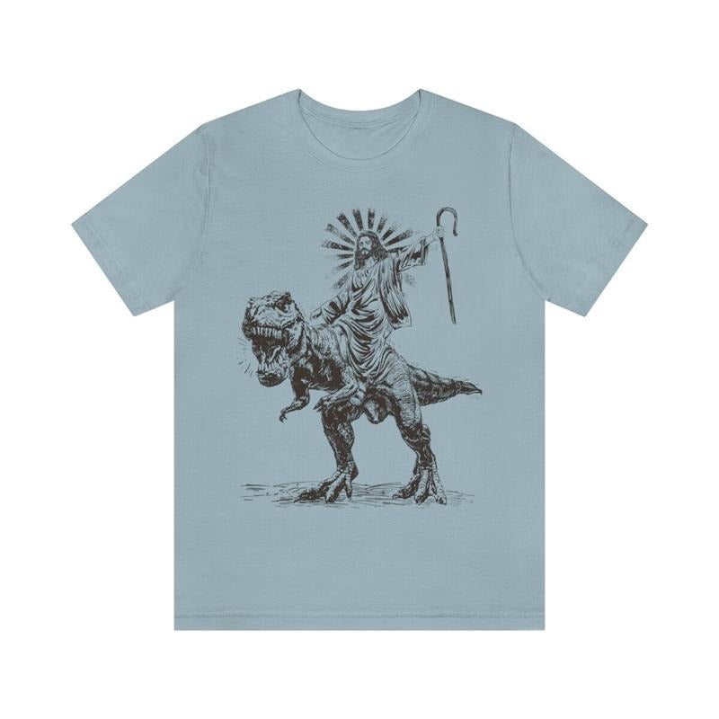 Jesus Riding T rex Dinosaur Shirt | Jesus T-shirt | Wild Dinosaur Sweatshirt Hoodie | UrbanDripWear.com