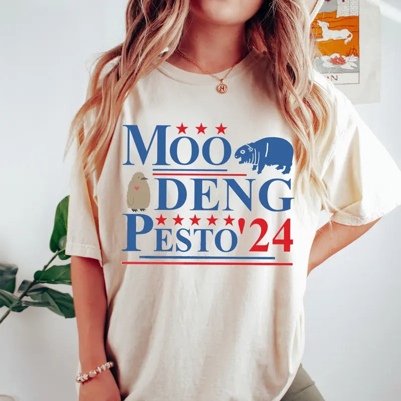 Moo Deng Pesto 2024 T Shirt, Funny Moo Deng Shirt, Baby Pesto Penguin Tshirt Hoodie, Sweatshirt | UrbanDripWear.com