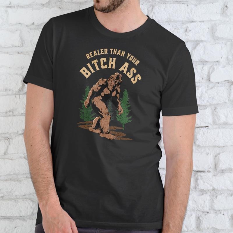 REALER THAN YOUR BIGFOOT T-Shirt Unisex Cotton Graphic Tee Medium Size Bold Eye-Catching Design Soft Comfortable Everyday...