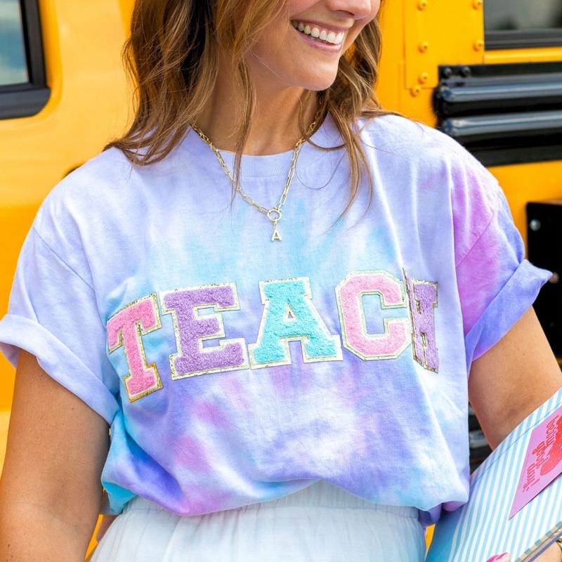 'Teach In Technicolor' Tie Dye Letter Patch T-Shirt Hoodie, Sweatshirt | UrbanDripWear.com