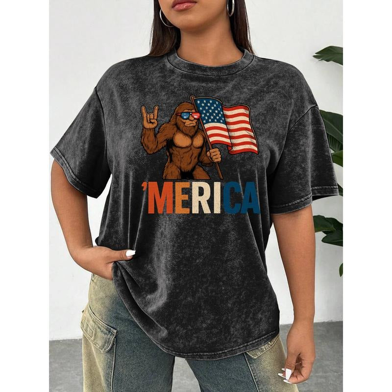 Women's Washed T - Shirt with a Cool Bigfoot Holding an American Flag and the Word 'MERICA