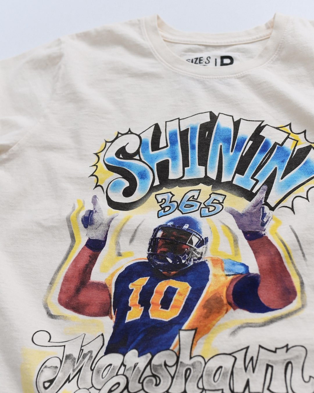 CAL - Marshawn Lynch Shinin' 365 White Tee