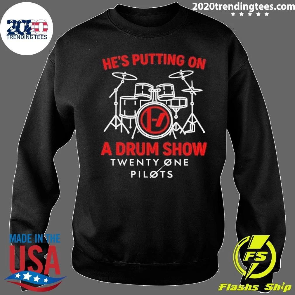 He’s putting on a drum show Twenty One Pilots shirt