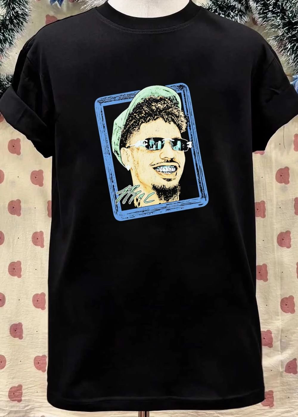 Man with sunglasses and grillz portrait shirt