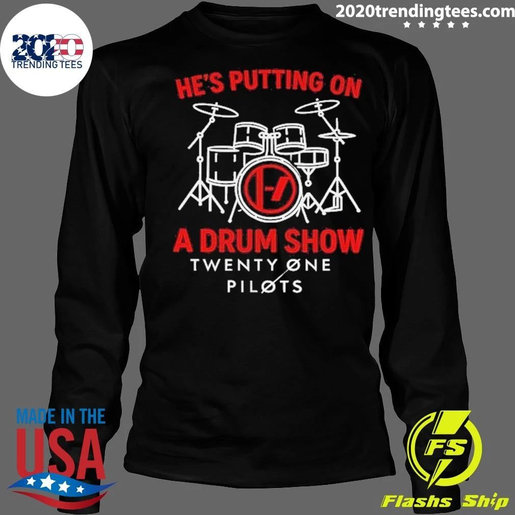 He’s putting on a drum show Twenty One Pilots shirt