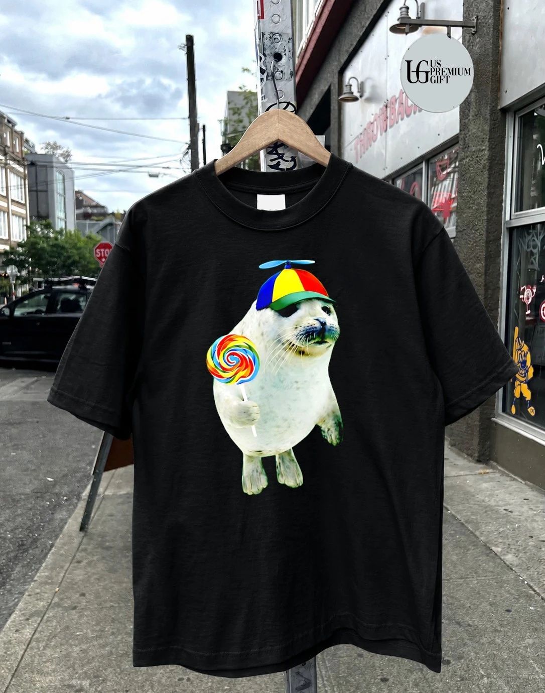 Cute Baby Seal with a Rainbow Lollipop and a Propeller Beanie shirt