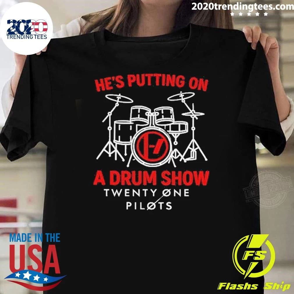 He’s putting on a drum show Twenty One Pilots shirt
