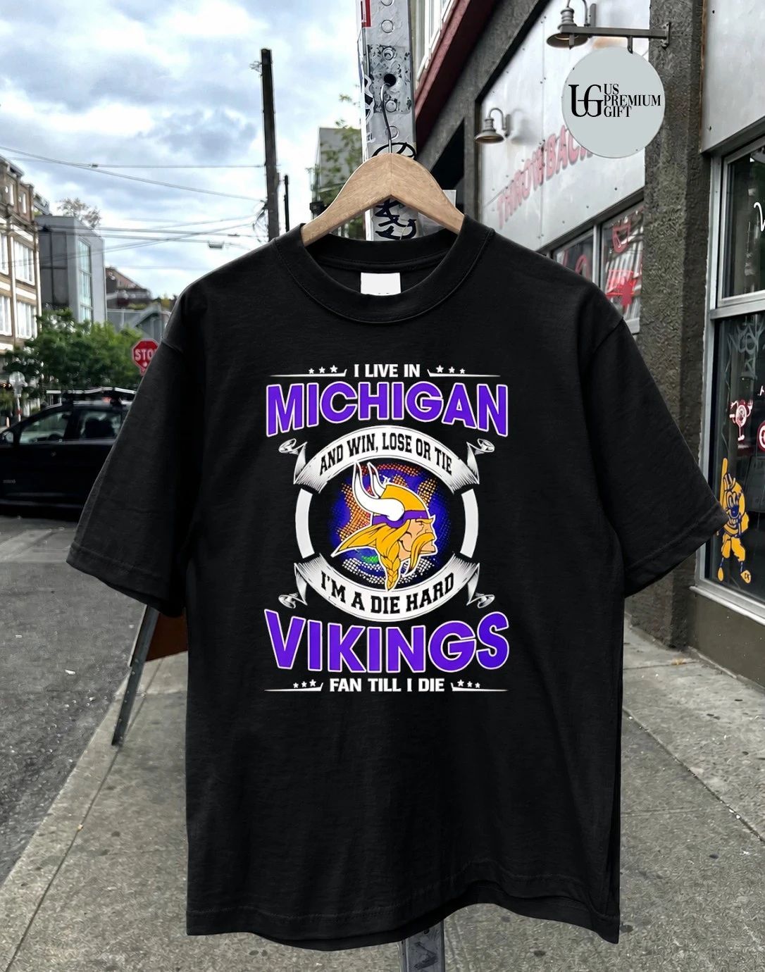 I Live In Michigan And Win Lose Or Tie Im A Die Hard Minnesota Vikings Fan Till I Die 2026 logo shirt
