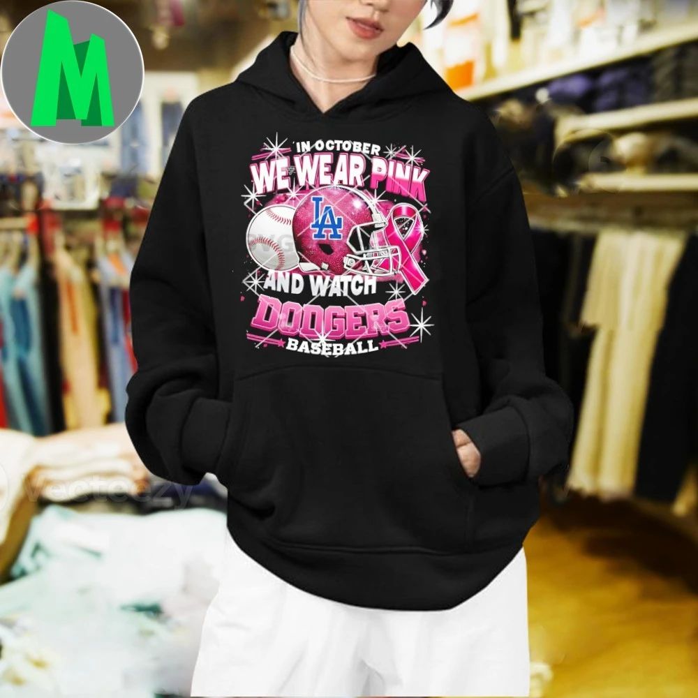 In October We Wear Pink And Watch Dodgers Baseball Breast Cancer Los Angeles Dodgers Helmet And Logo Shirt